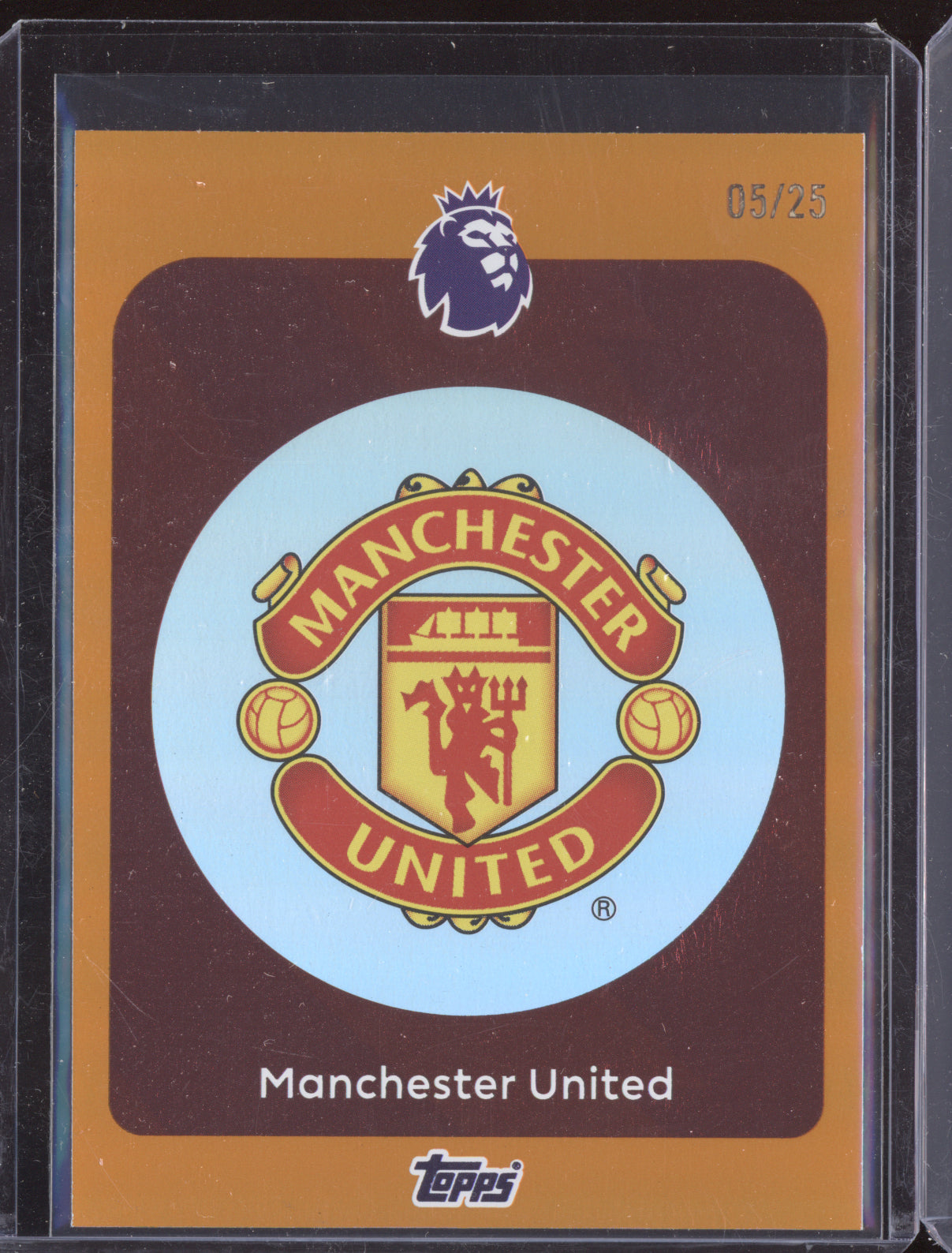Manchester United 2025-26 Topps Premier League Team Badges Orange 5/25